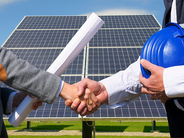 Handshake over solar panels