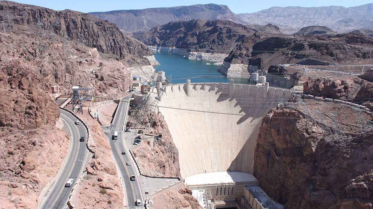 An aerial of Hoover Dam with Lake Mead in the background
