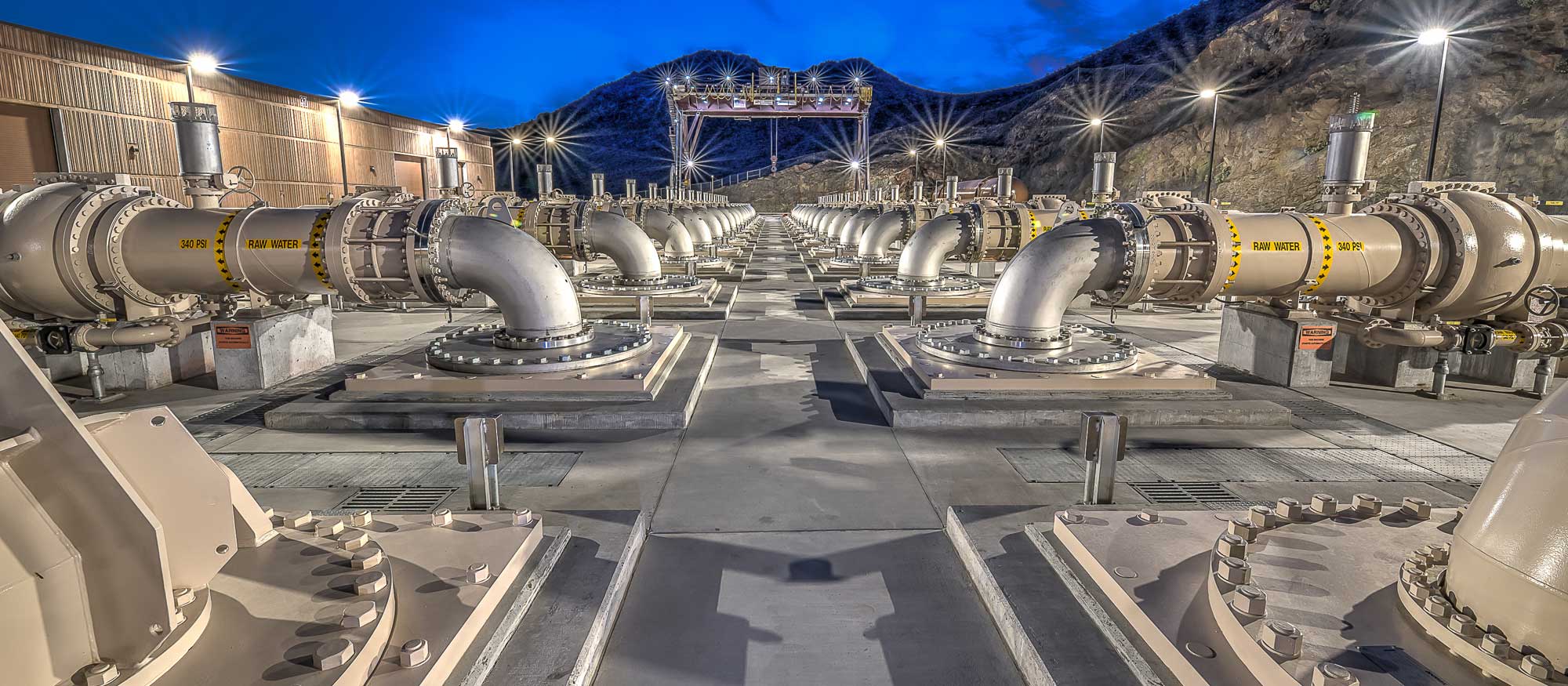 Night shot of pipes coming out of ground at Low Lake Level Pumping Station