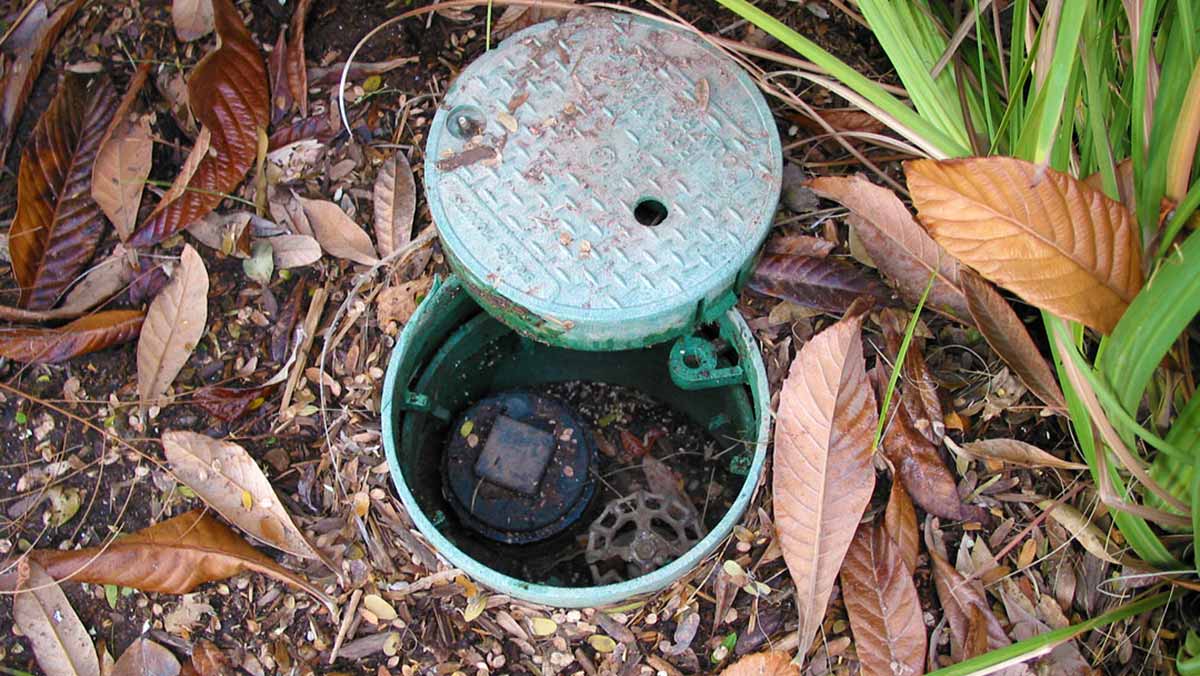 An example of an enclosed pool clean-out port.