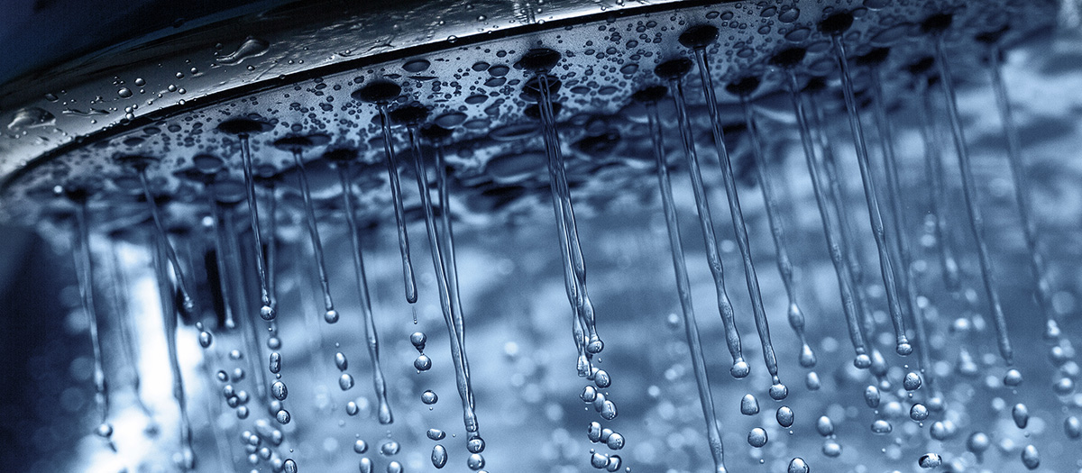 close up of showerhead spraying water