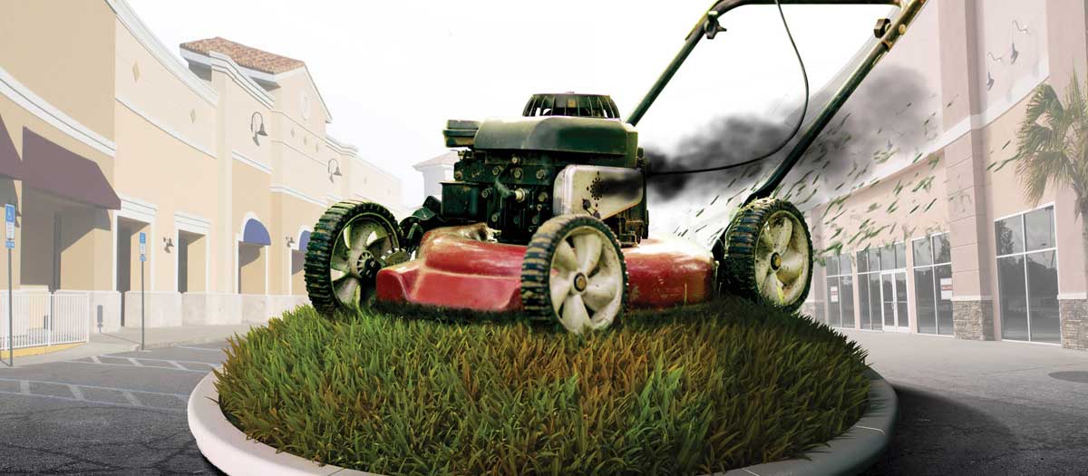 Composite image of a smoking lawn mower cutting grass with business storefronts in background